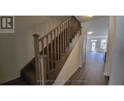 A staircase with a wooden banister and steps.