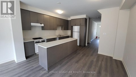A kitchen with a counter top and cabinets.