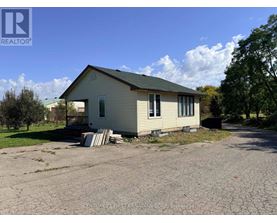 A house with a driveway in front of it.