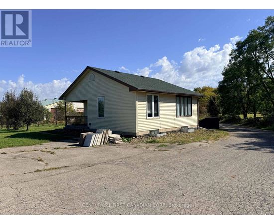A house with a driveway in front of it.