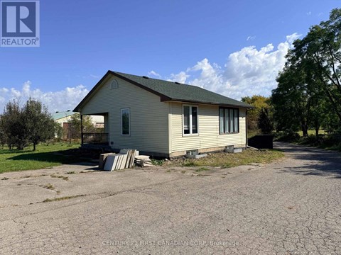 A house with a driveway in front of it.