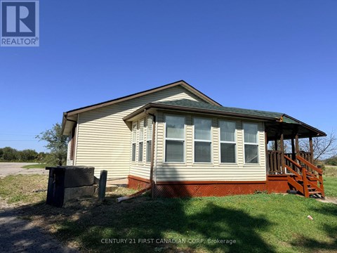 A house with a porch and a covered entry way.