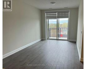 A room with a sliding glass door leading to a balcony.