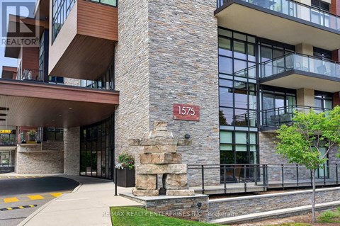 The building has a stone pillar with the number 1576 on it.