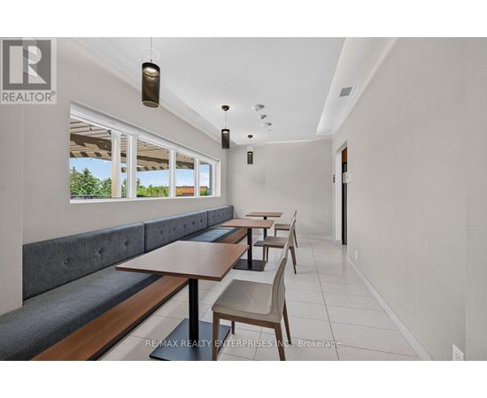 A dining area with a table and chairs.