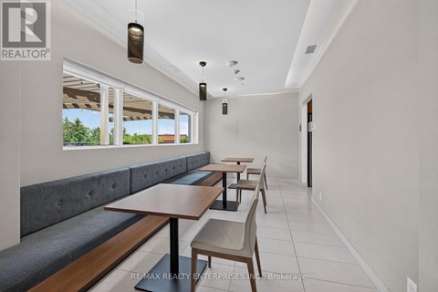 A dining area with a table and chairs.