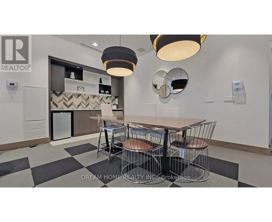 A dining area with a table and chairs.