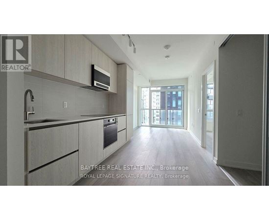 A modern kitchen with a microwave above the stove.