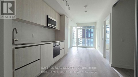 A modern kitchen with a microwave above the stove.