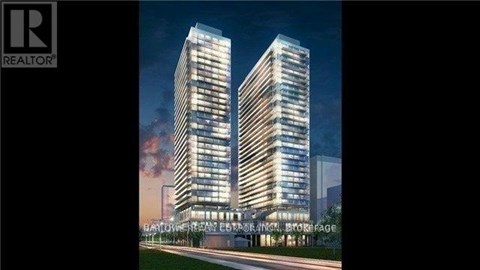 A modern building with a glass facade is depicted in the image.