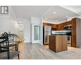 A modern kitchen with wooden cabinets and a central island.