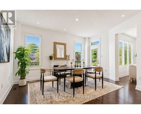 A dining room with a table set for four.