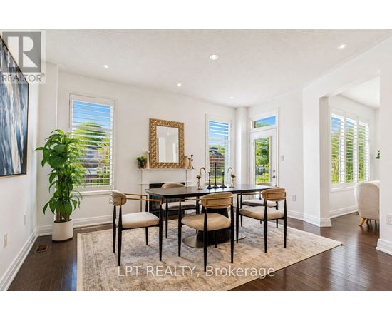 A dining room with a table set for four.