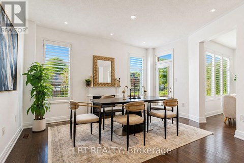 A dining room with a table set for four.