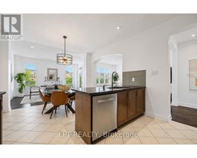 A modern kitchen with a dining table and chairs.