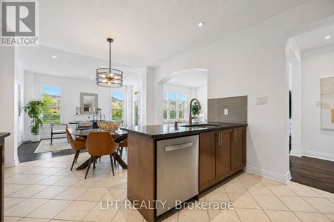A modern kitchen with a dining table and chairs.