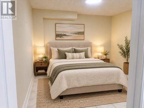 A bedroom with a bed, nightstands, and a painting on the wall.