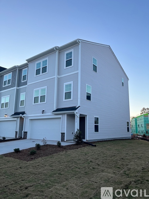 A modern two-story house with a garage.