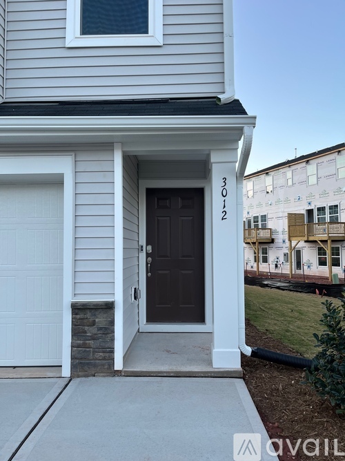 A house with the number 3012 on the front door.