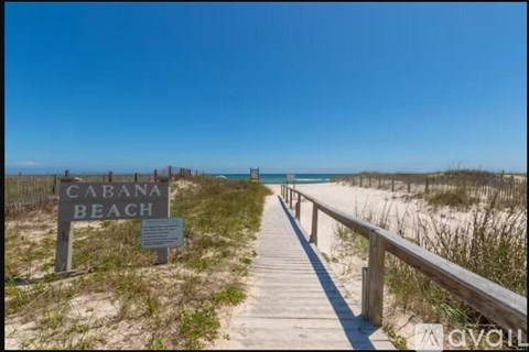 A wooden walkway leads to Cabana Beach.