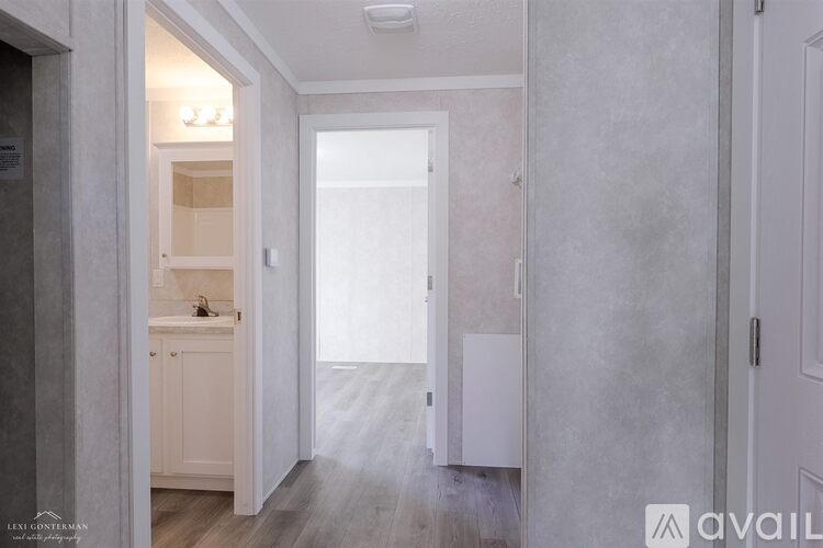 A bathroom with a sink and a toilet in it.