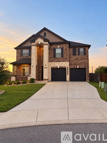 A house with a driveway in front of it.