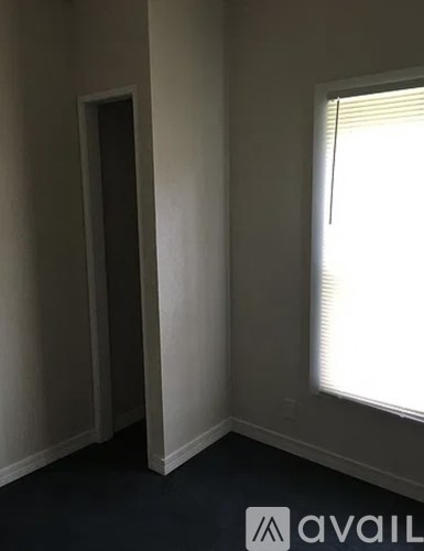 A room with a door and a window.