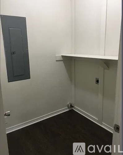 A room with a white door and a white cabinet.