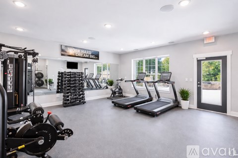 A gym with a sign that says "Work Hard Dream Big".