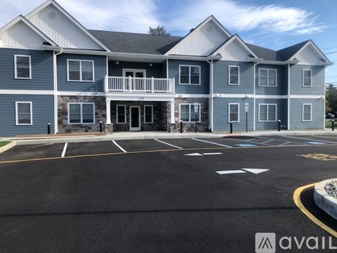 A large building with a parking lot in front of it.