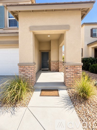 A house with a front porch and a brown door.