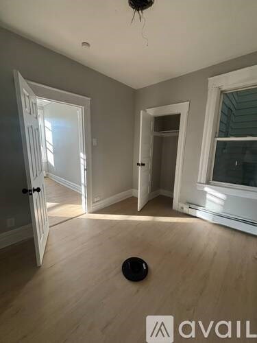 A room with a door and a window.