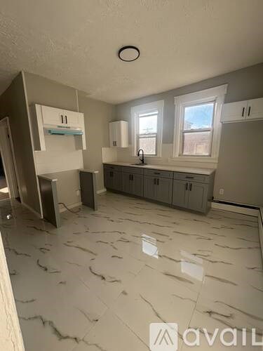 A kitchen under construction with a countertop and cabinets.