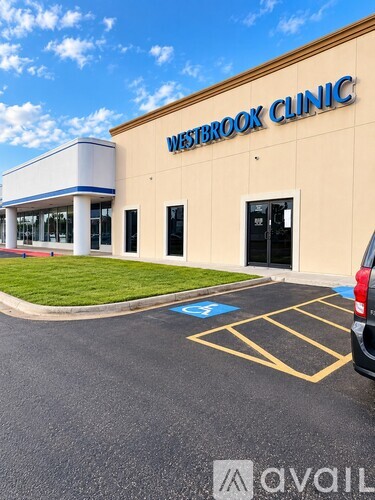 A Westbrook Clinic building with a parking lot in front.