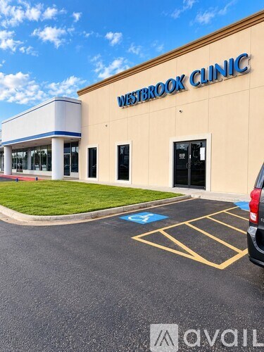 A Westbrook Clinic building with a parking lot in front.