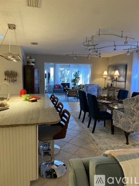 A well-lit dining area with a table set for six.