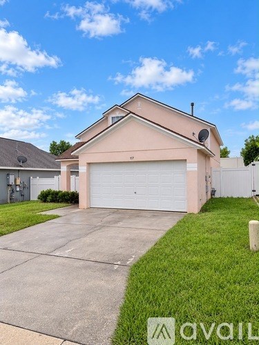 A two-car garage is attached to a house.