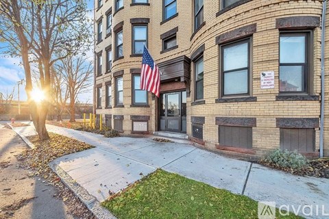 A building with an American flag hanging on the front.
