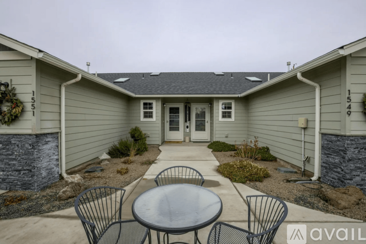 A patio with a table and chairs is available for rent.