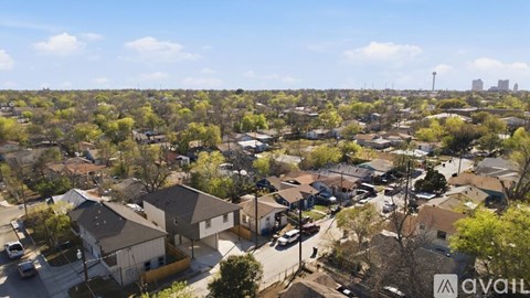 A suburban neighborhood with houses and trees.
