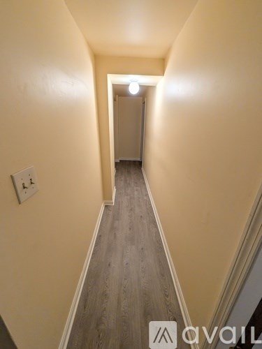 A hallway with a light at the end.