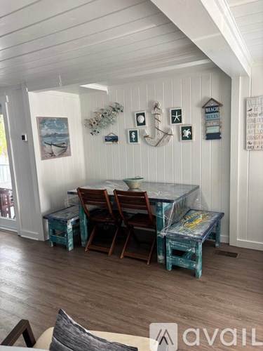 A dining room with a glass table and chairs.