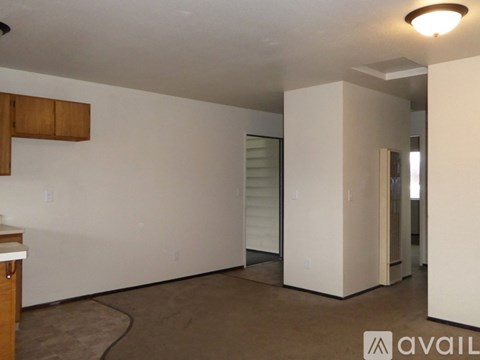 A kitchen with a white fridge and a stove top oven.