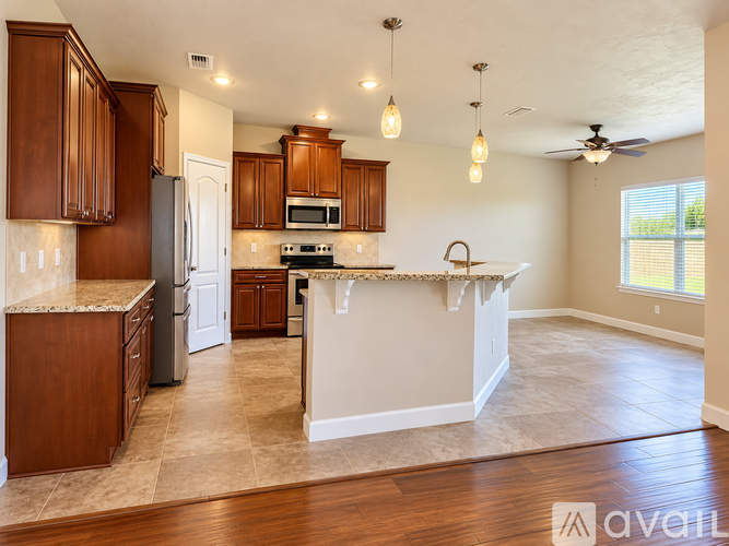 A kitchen with wooden cabinets and a white countertop.