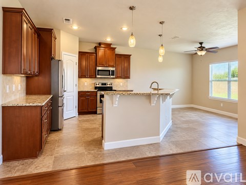 A kitchen with wooden cabinets and a white countertop.