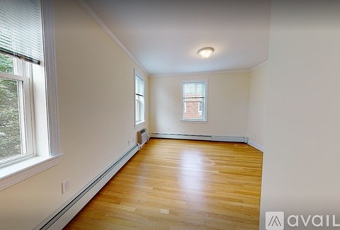 A room with wooden floors and a window.