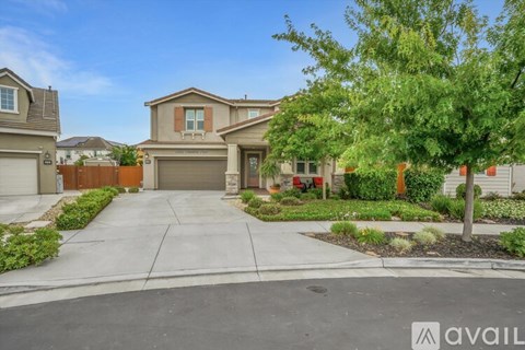 A house with a driveway in front of it is for sale.