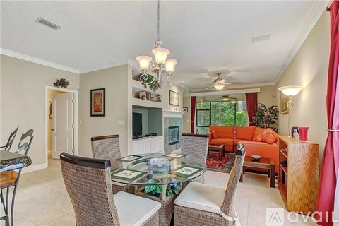 A dining room with a glass table and chairs.