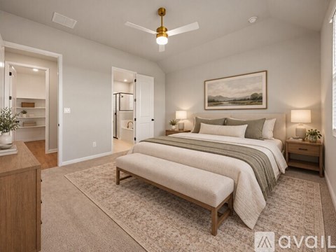 A bedroom with a large bed and a painting on the wall.