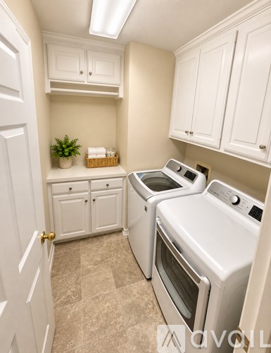 A small kitchen with a white oven and microwave.